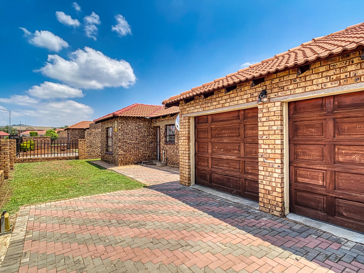 services-02 Beautiful brick home with double garage and paved driveway in Pretoria, South Africa.